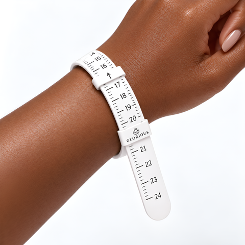 Glorious bracelet sizer wrapped around a wrist, showing the measurement scale.